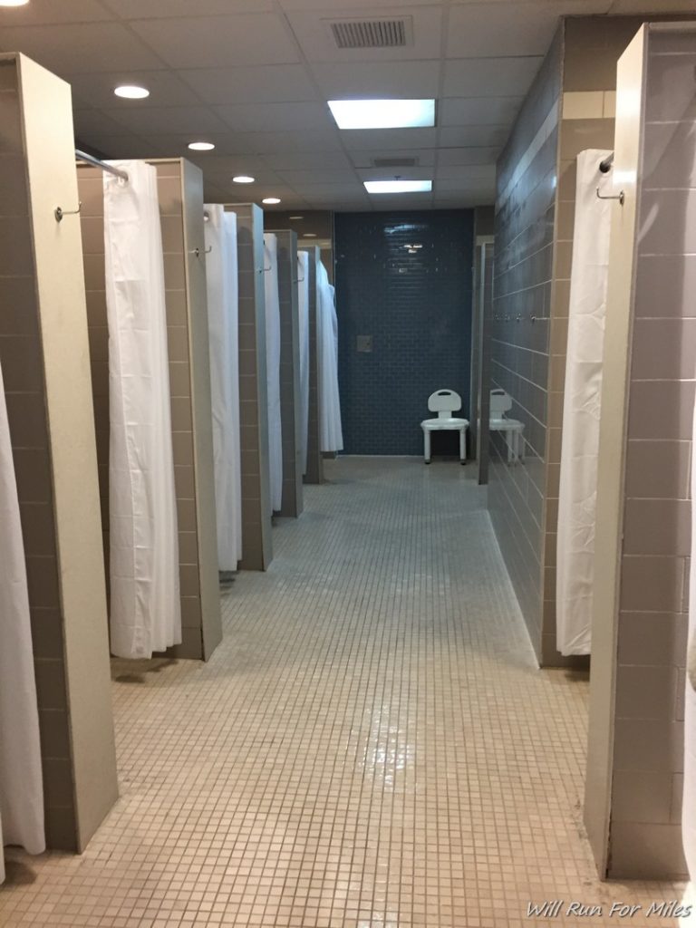 a bathroom with shower curtains and a toilet