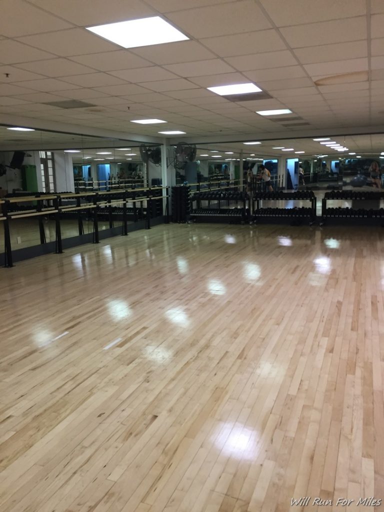 a large room with a mirror and a large mirror