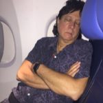 a man sleeping on an airplane