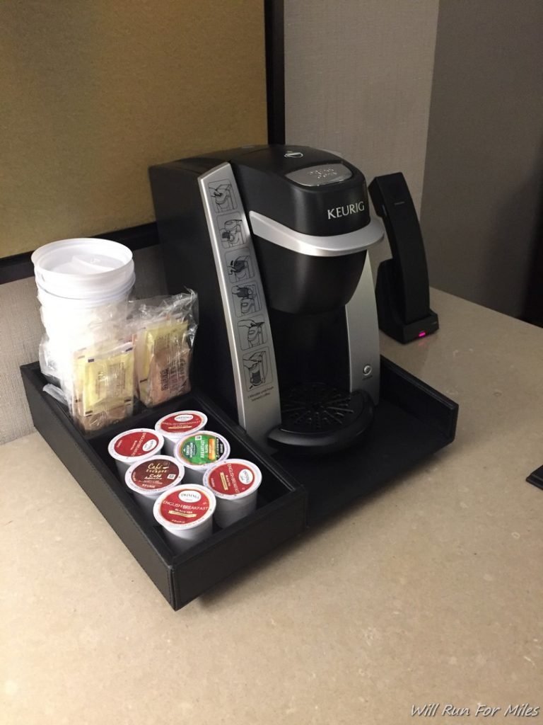 a coffee machine and a tray of k-cups