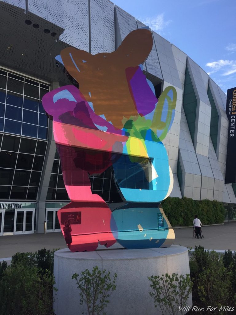 a colorful sculpture outside of a building