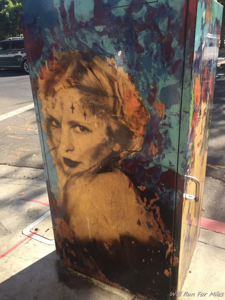 a painted box on the sidewalk