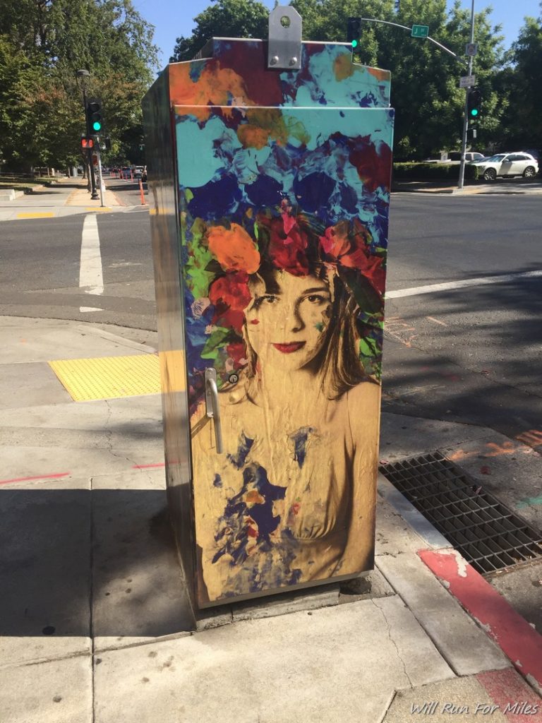 a painted box on a sidewalk