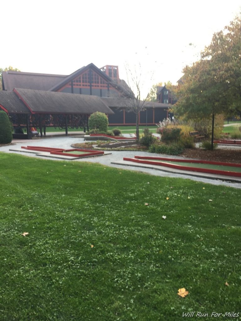 a building with a lawn and trees