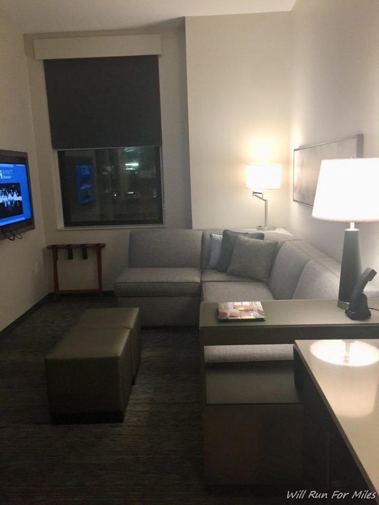 a living room with a couch and a tv