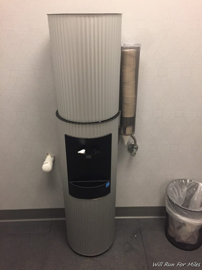a water dispenser with a paper towel dispenser