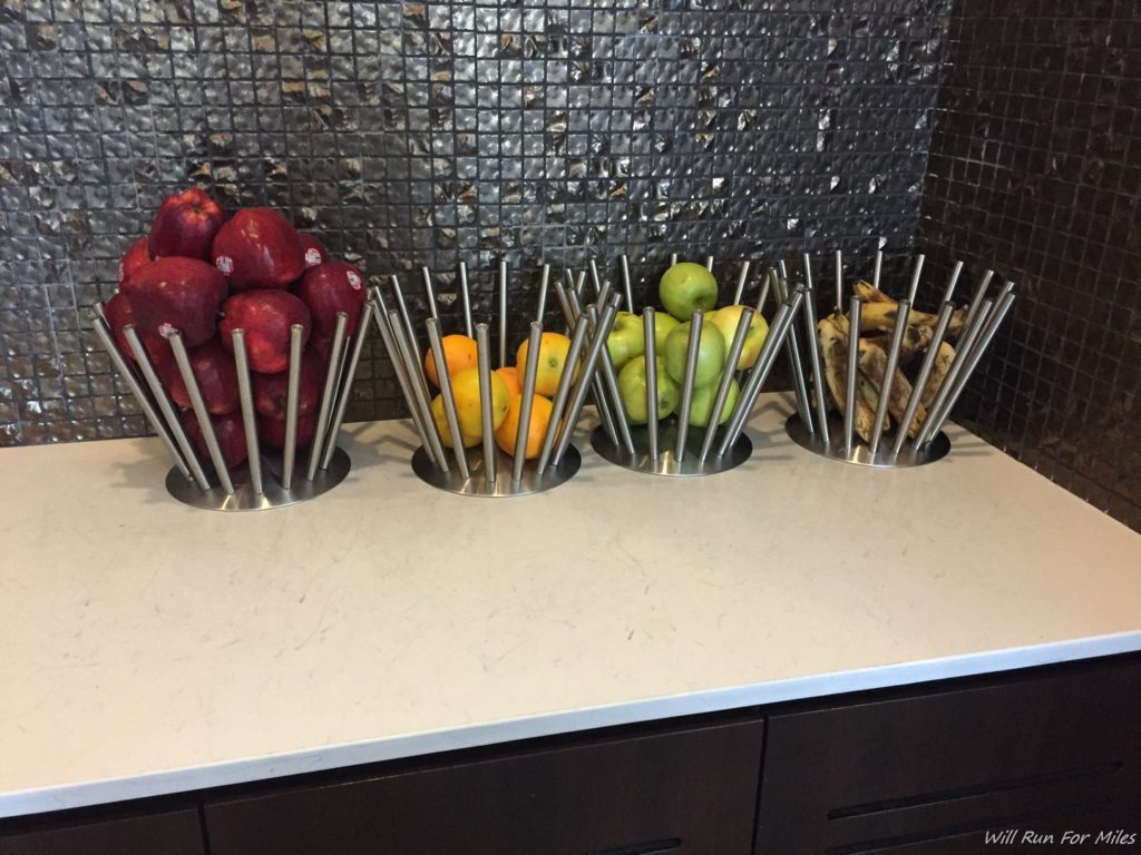a group of fruit in metal containers