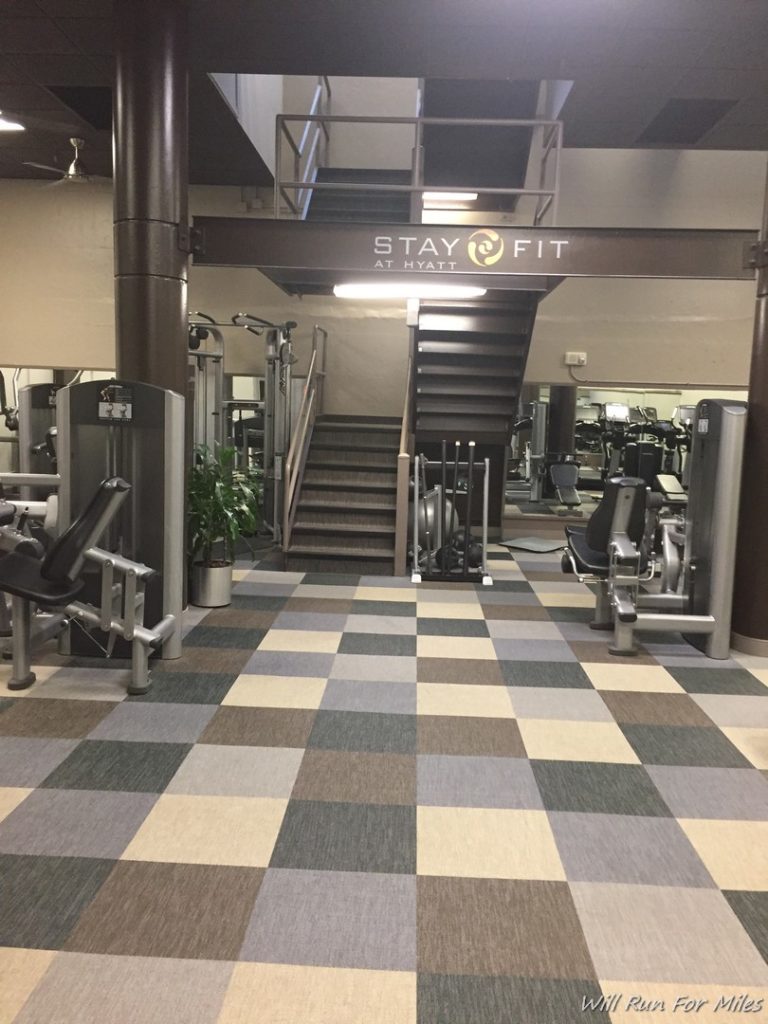 a gym with stairs and exercise equipment