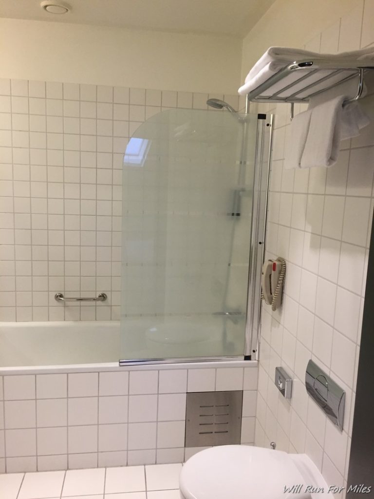 a bathroom with a glass door