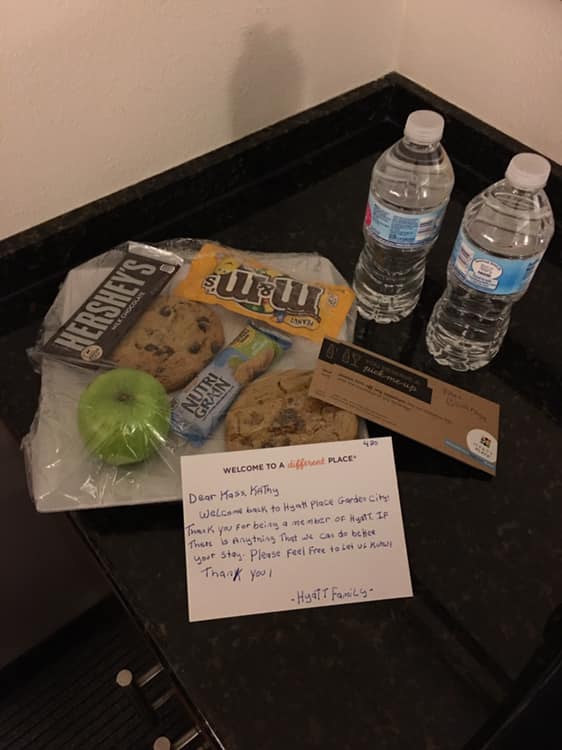 a welcome card and food on a table