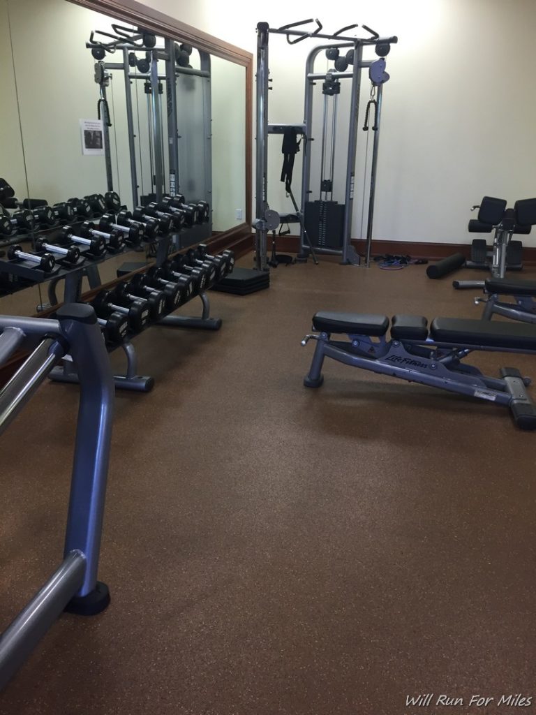 a gym with weights and exercise equipment