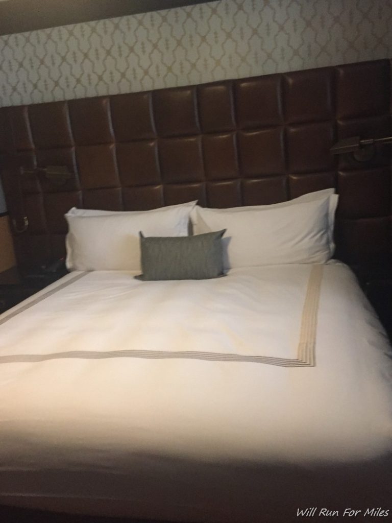 a bed with pillows on it