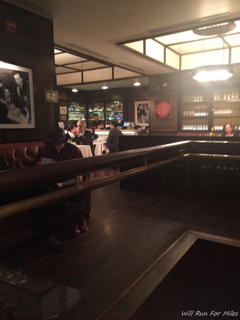 a group of people sitting at tables in a restaurant