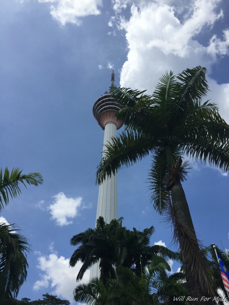 a tall tower with palm trees
