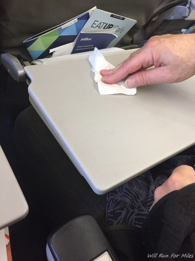 a hand holding a napkin on a table