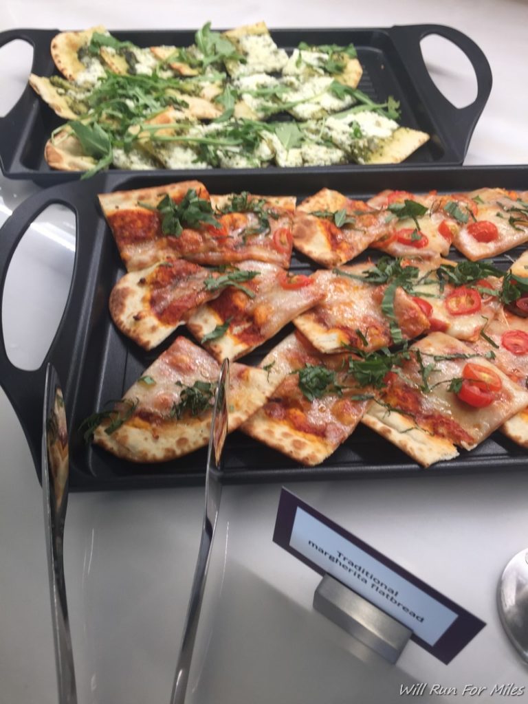 a trays of pizzas on a table