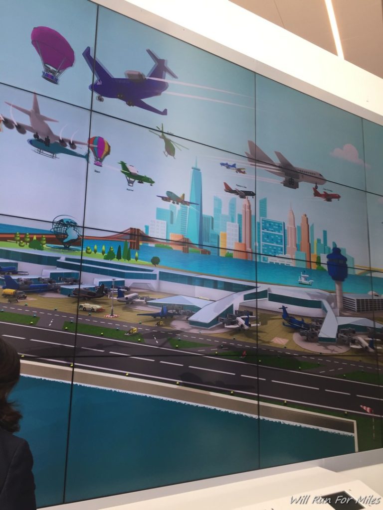 a wall with a picture of airplanes and buildings