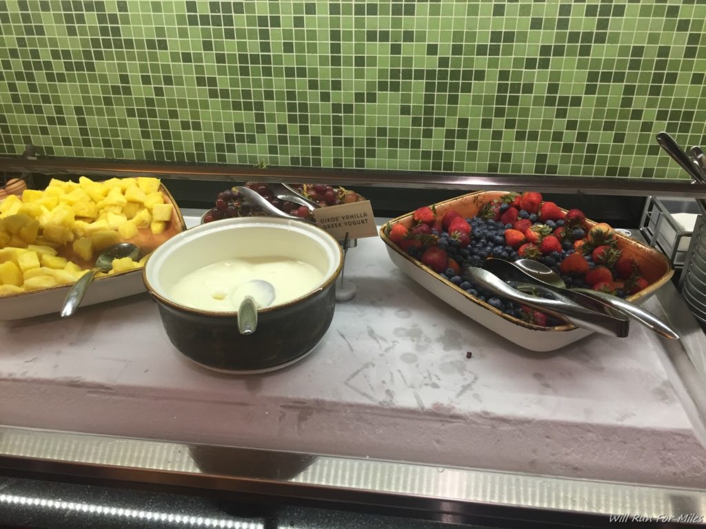 a bowl of fruit and a bowl of yogurt