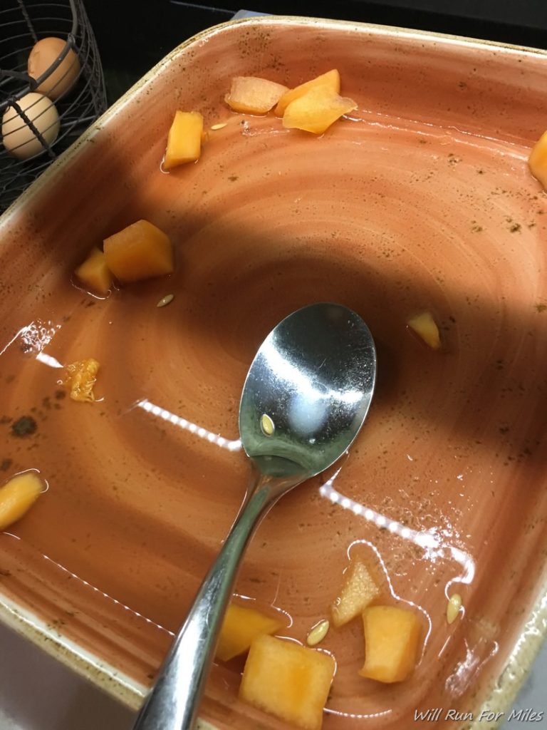 a bowl of food with a spoon