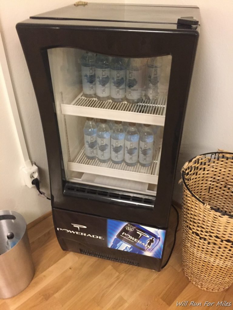 a cooler with bottles of water in it