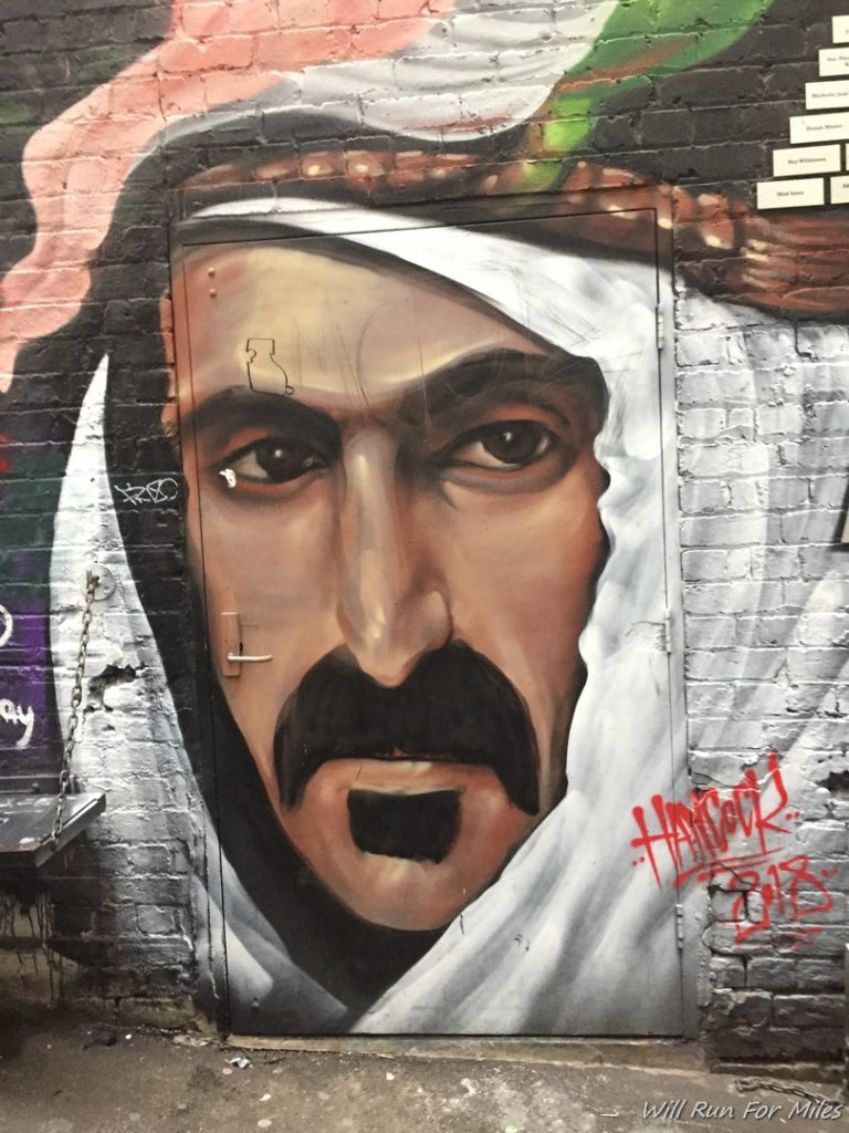 a mural of a man with a mustache
