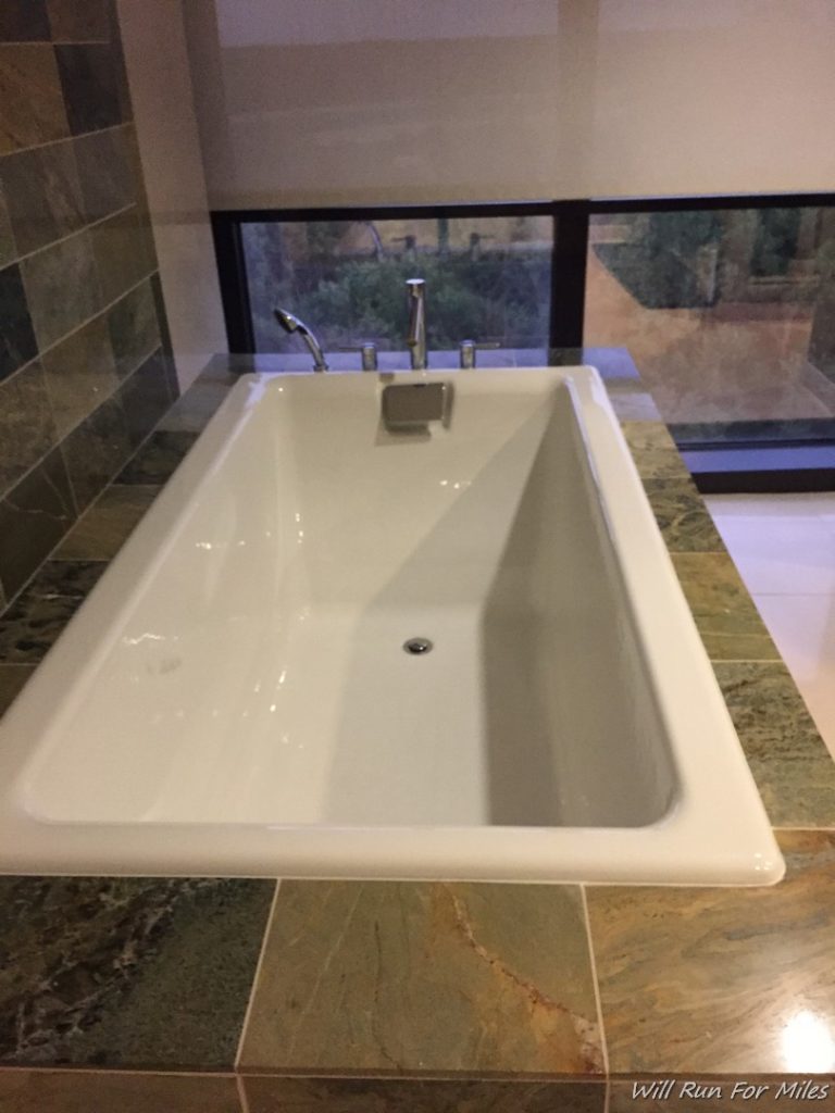 a white bathtub with a window