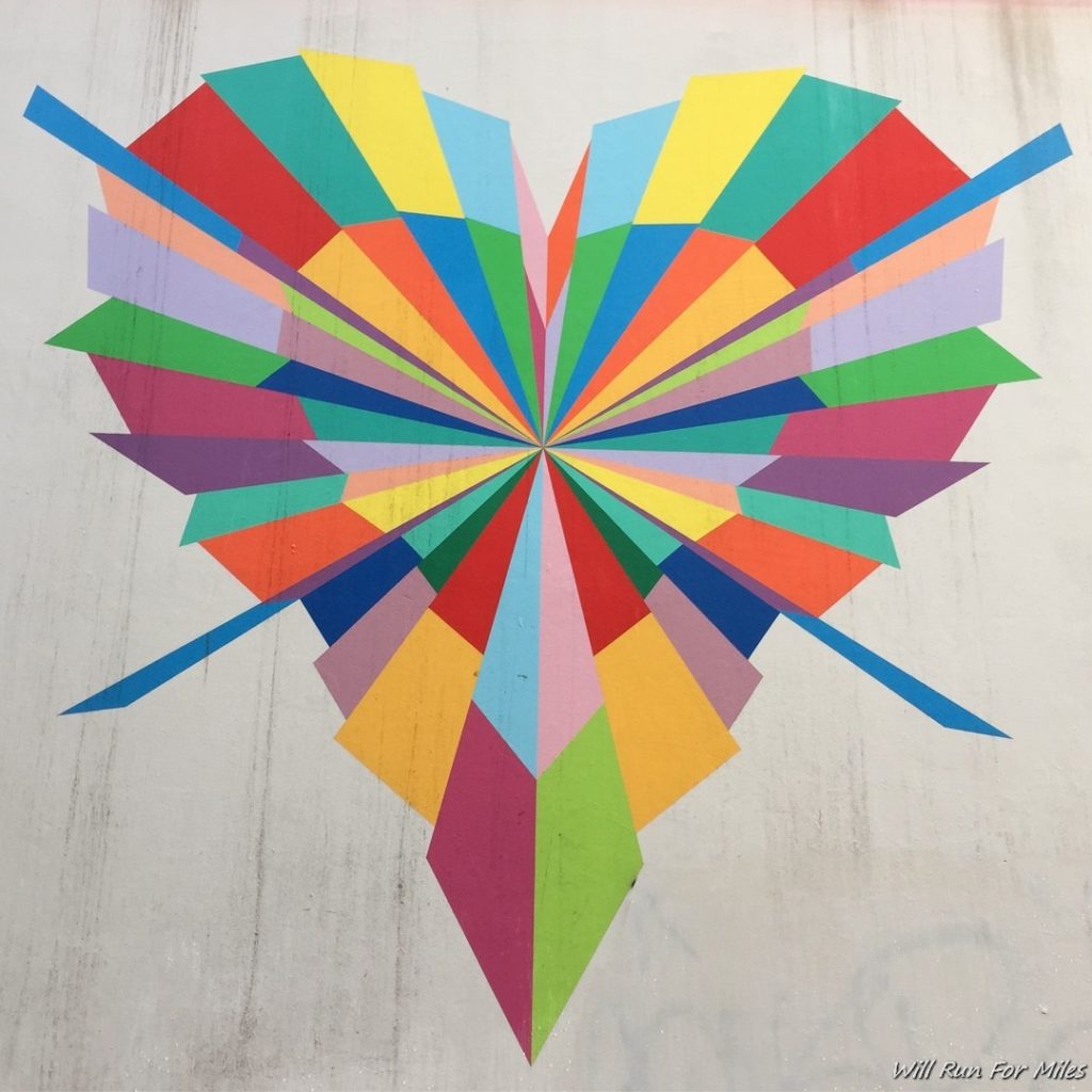 a colorful heart painted on a wall