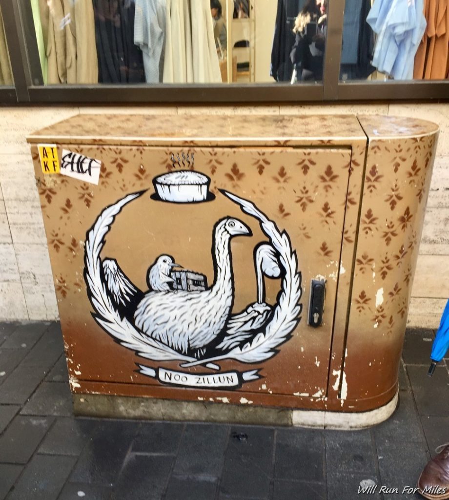 a metal box with a picture of birds on it
