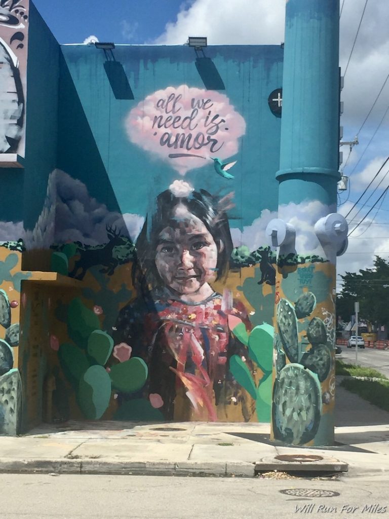 a mural of a girl on a building