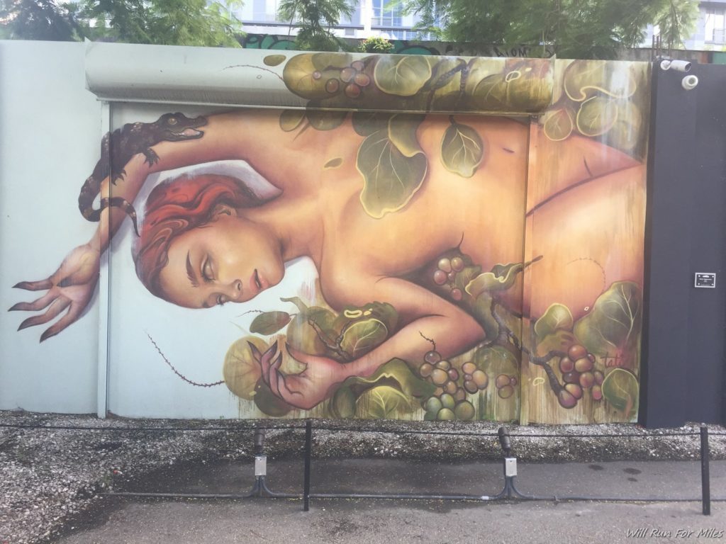 a mural of a woman sleeping on a wall