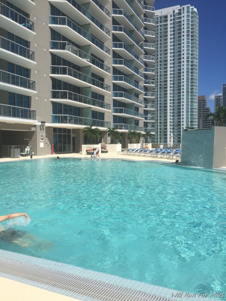 a pool with people swimming in it