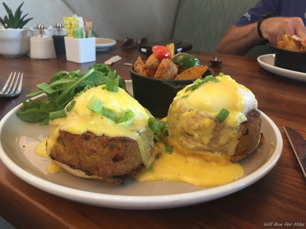 food on a plate with a bowl of potatoes and a bowl of food