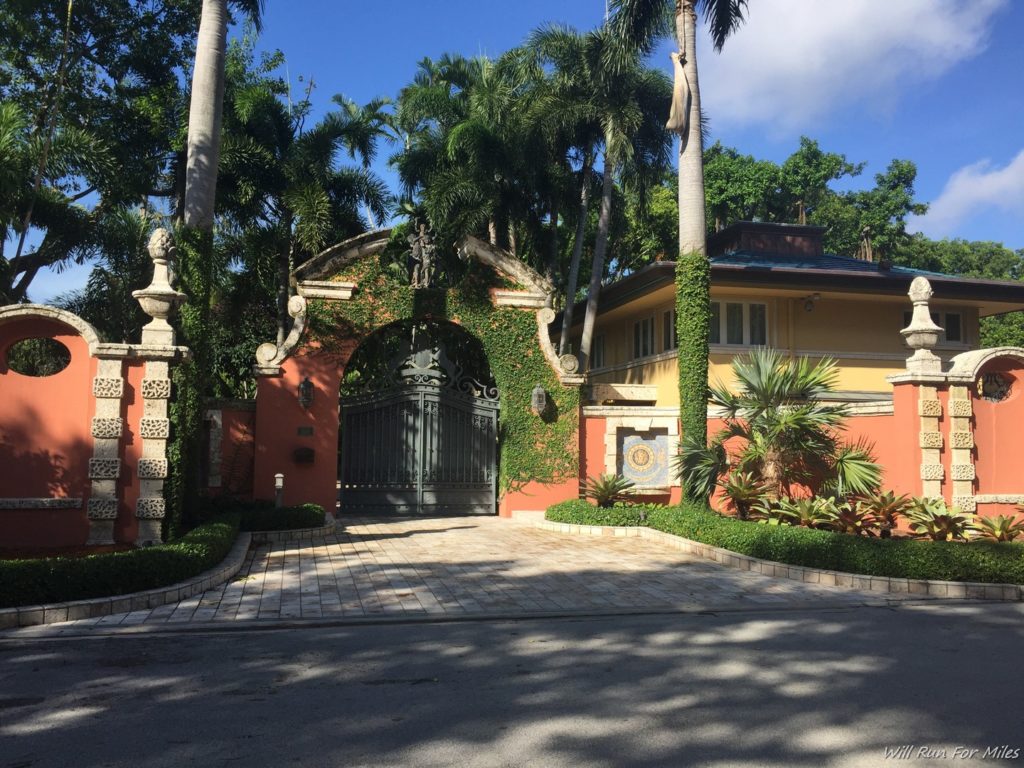 a house with a gate and trees