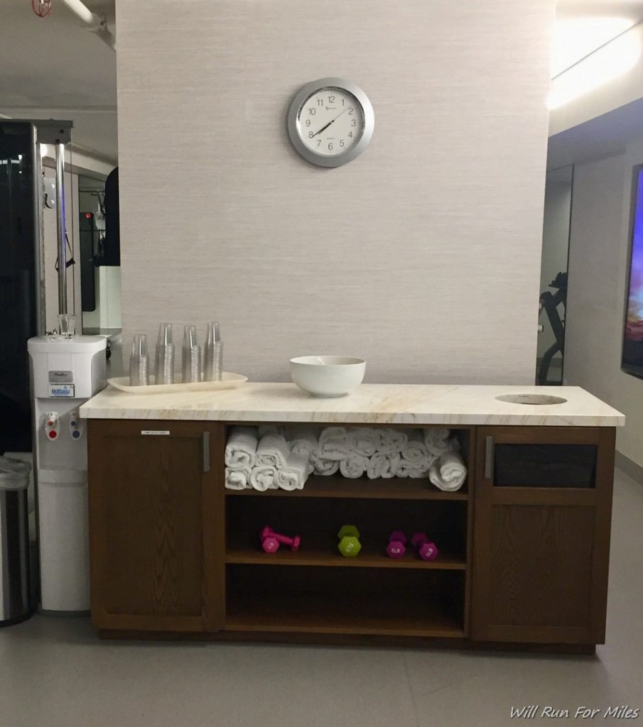 a white sink with towels on top of it