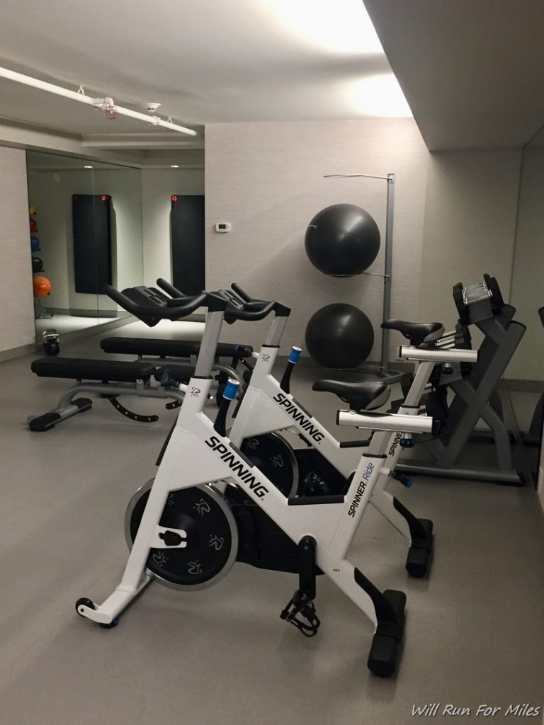 a room with exercise bikes and exercise balls