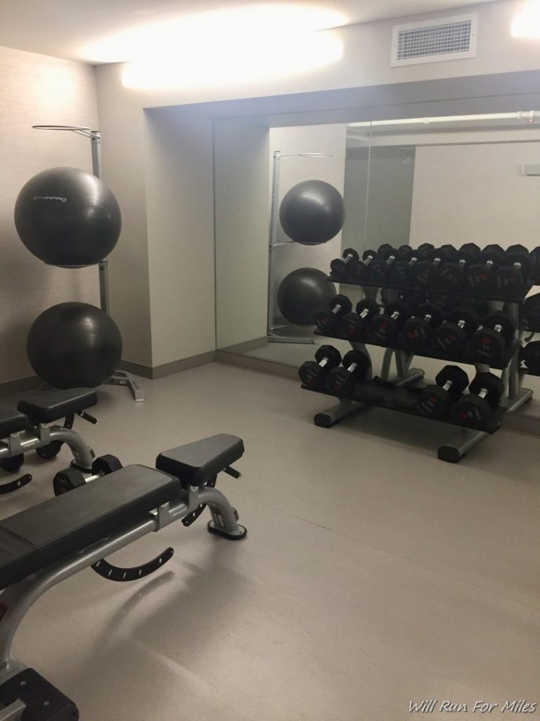 a room with weights and a mirror