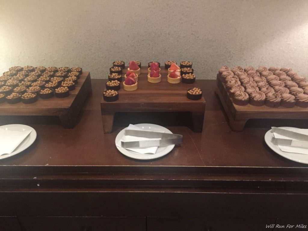 a table with desserts and utensils