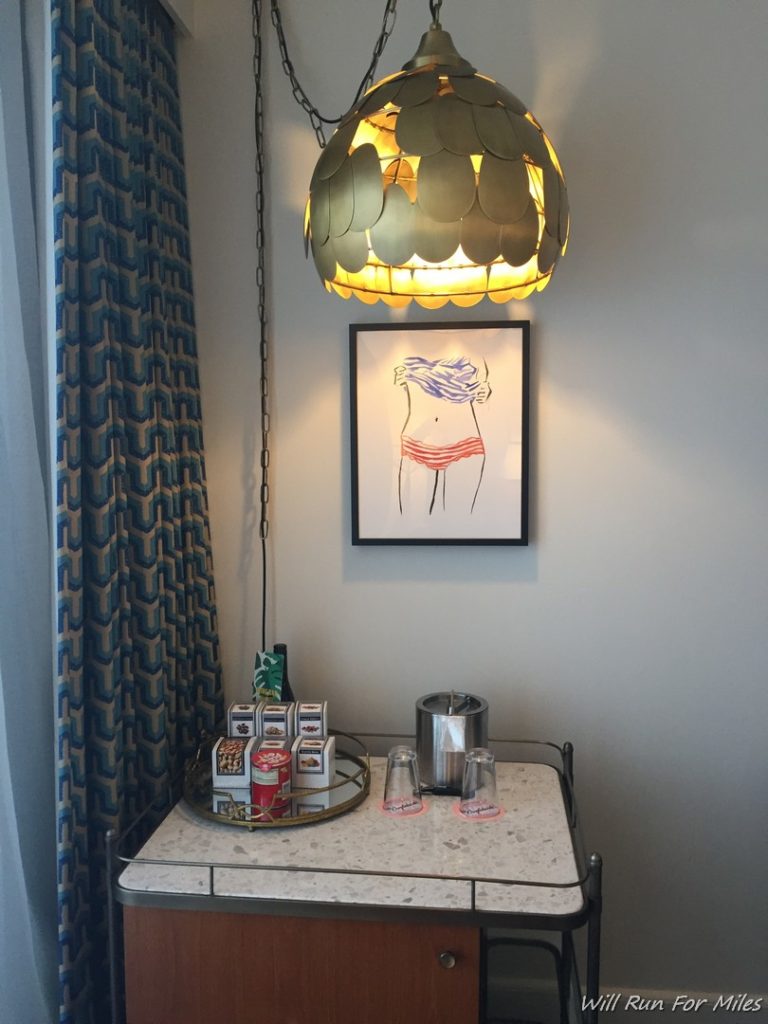a table with a picture and a lamp