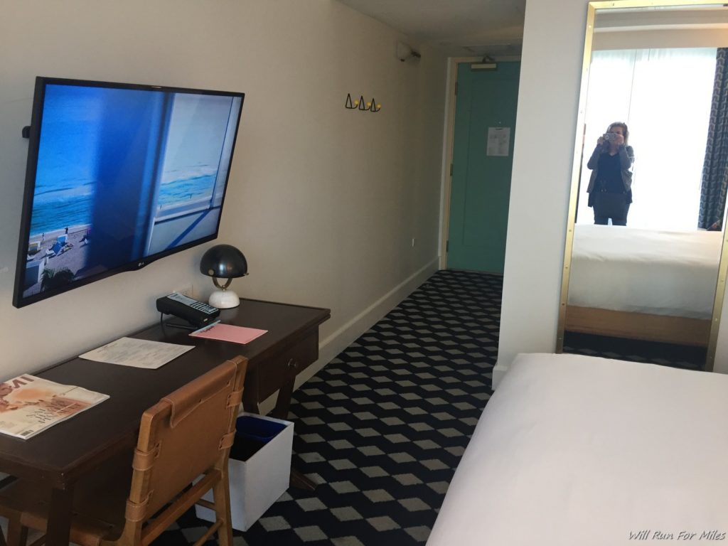 a room with a television and a bed