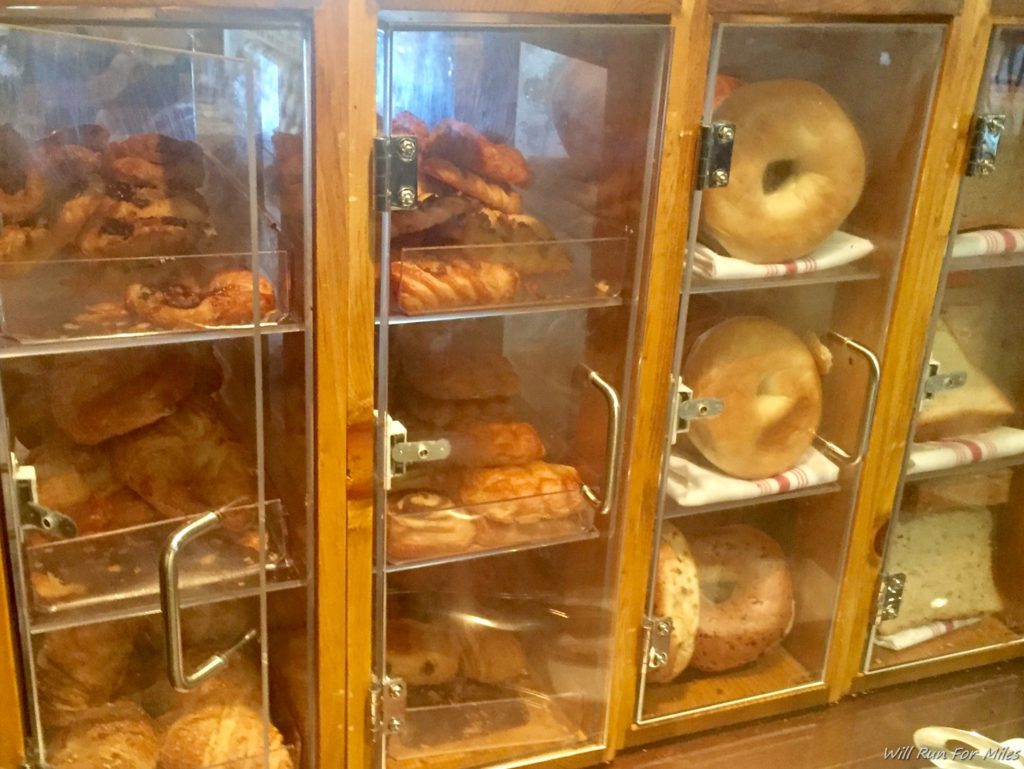 a display case with different types of bread