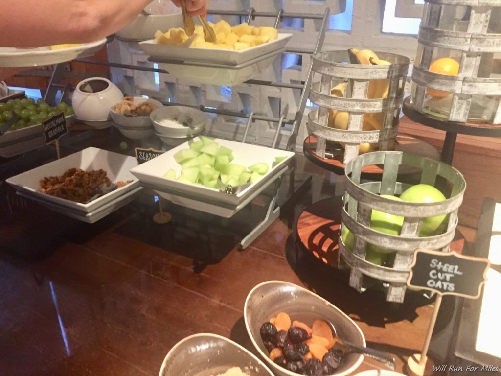 a buffet table with different bowls of food
