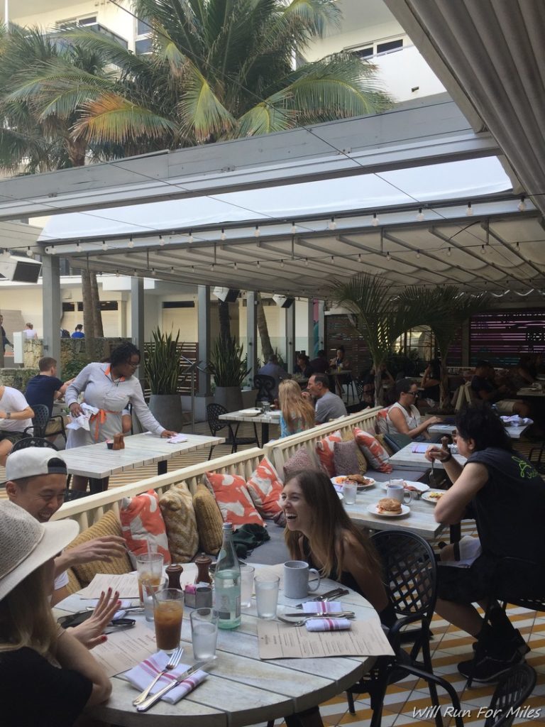 a group of people sitting at tables