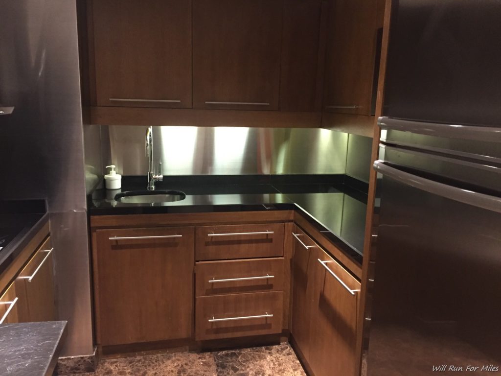 a kitchen with a sink and refrigerator