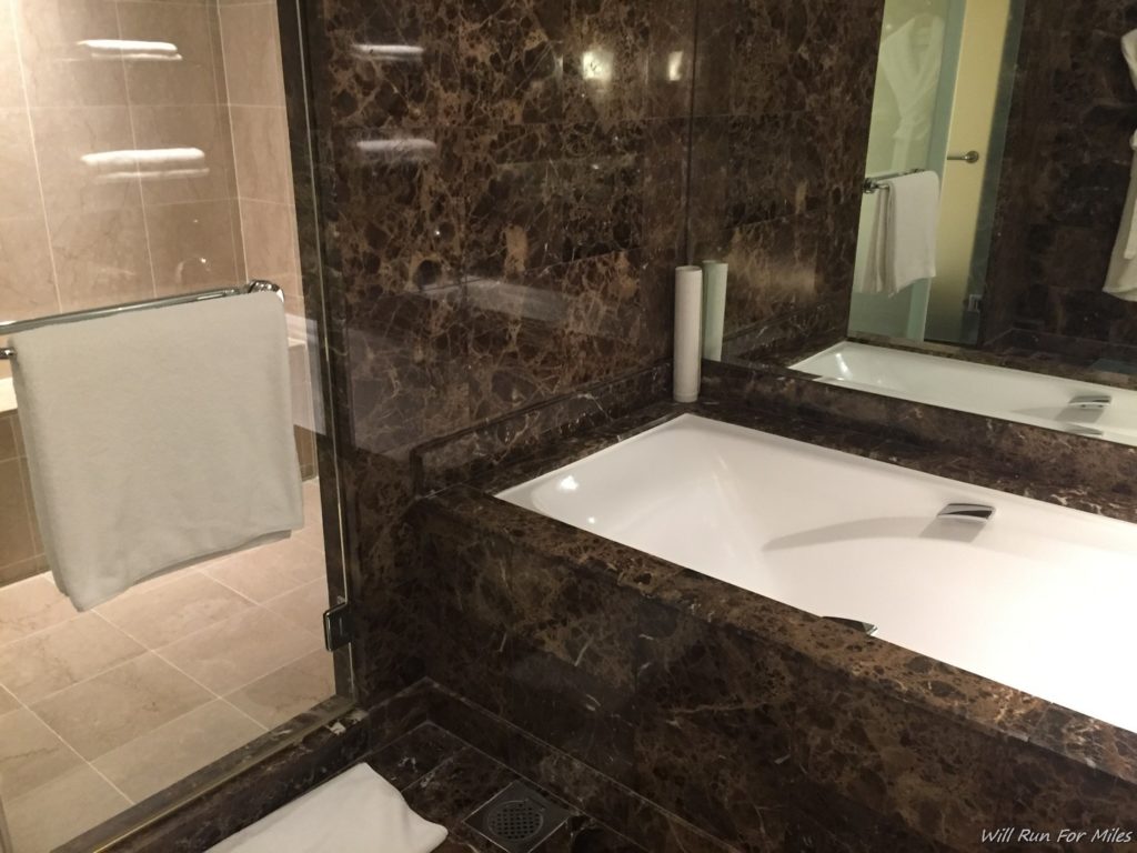 a bathroom with a bathtub and a shower