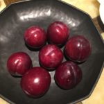 a bowl of plums