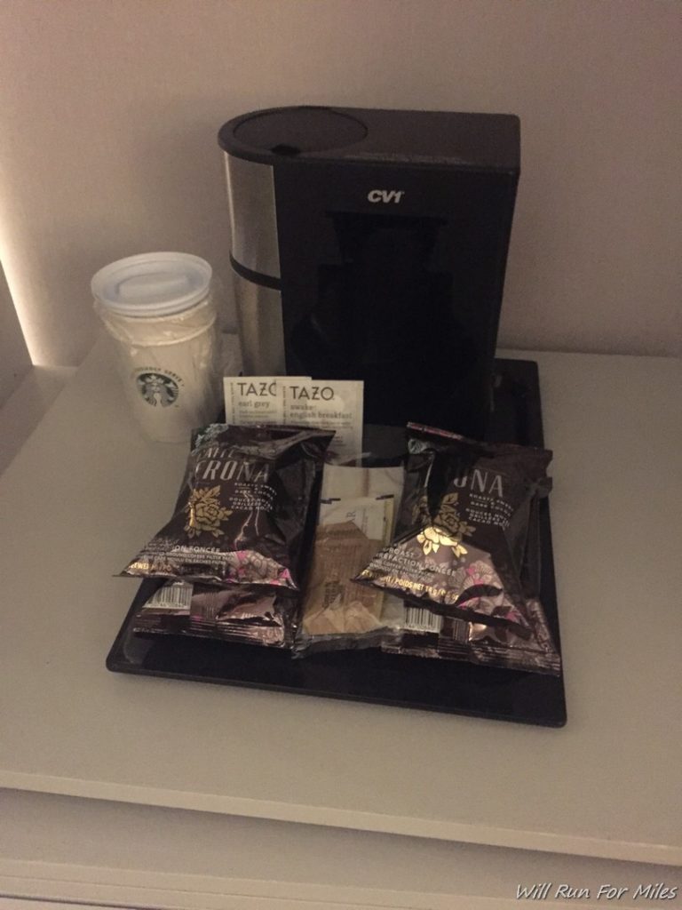 a coffee machine and food on a table