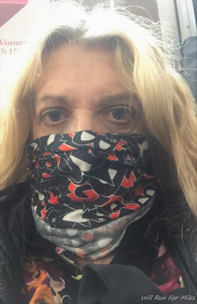 a woman with a scarf over her face