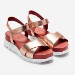 a pair of pink and white sandals