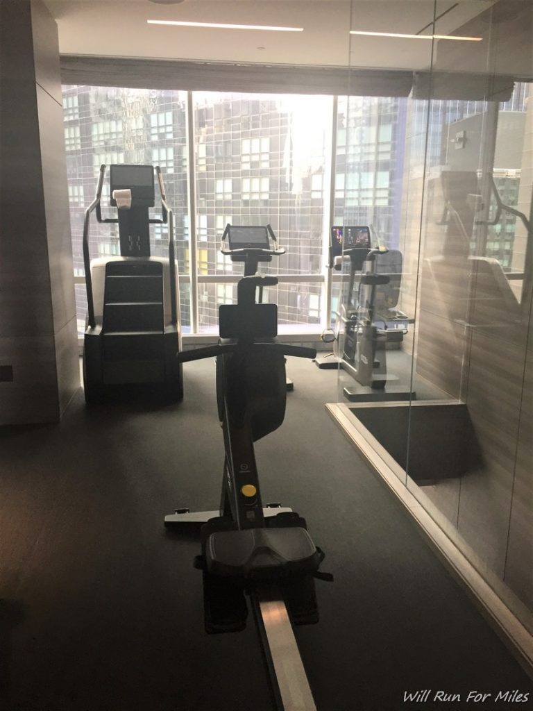 exercise machines in a room with a window