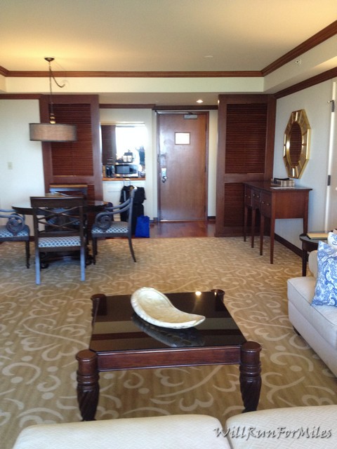 a living room with a table and chairs